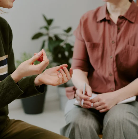 1 Therapist talking with a couple during a counselling session